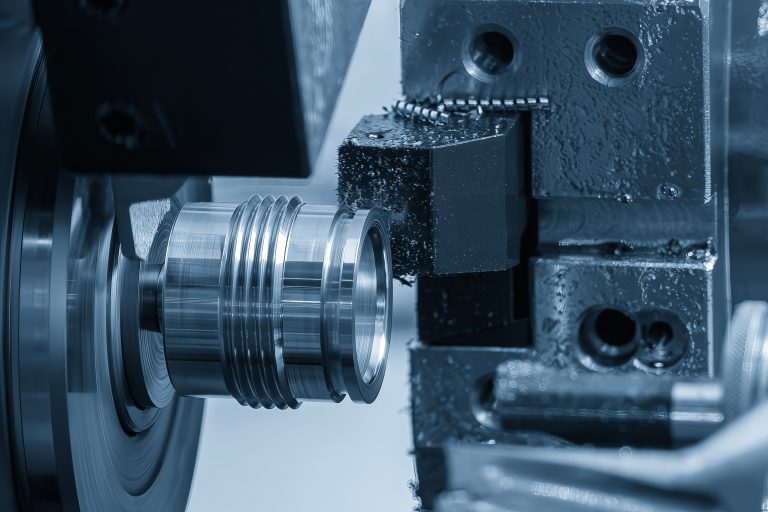 The  CNC lathe machine swiss type  thread  cutting the metal shaft parts