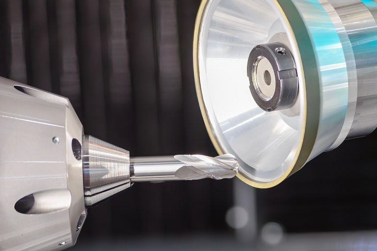 Close up scene the ball nose end mill tool regrinding process on regrinding machine